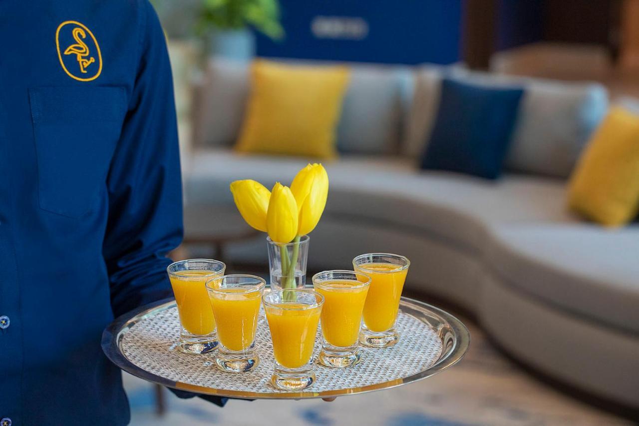 Voco Al Khobar By Ihg Hotel Exterior photo A tray of orange juice